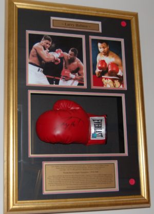 Larry Holmes signed and framed boxing glove.